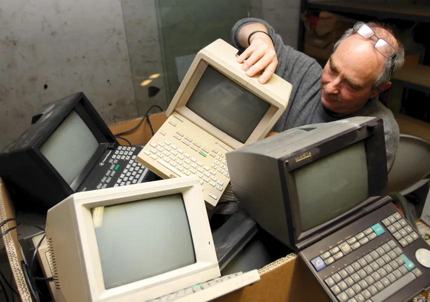 man covered in minitel terminals